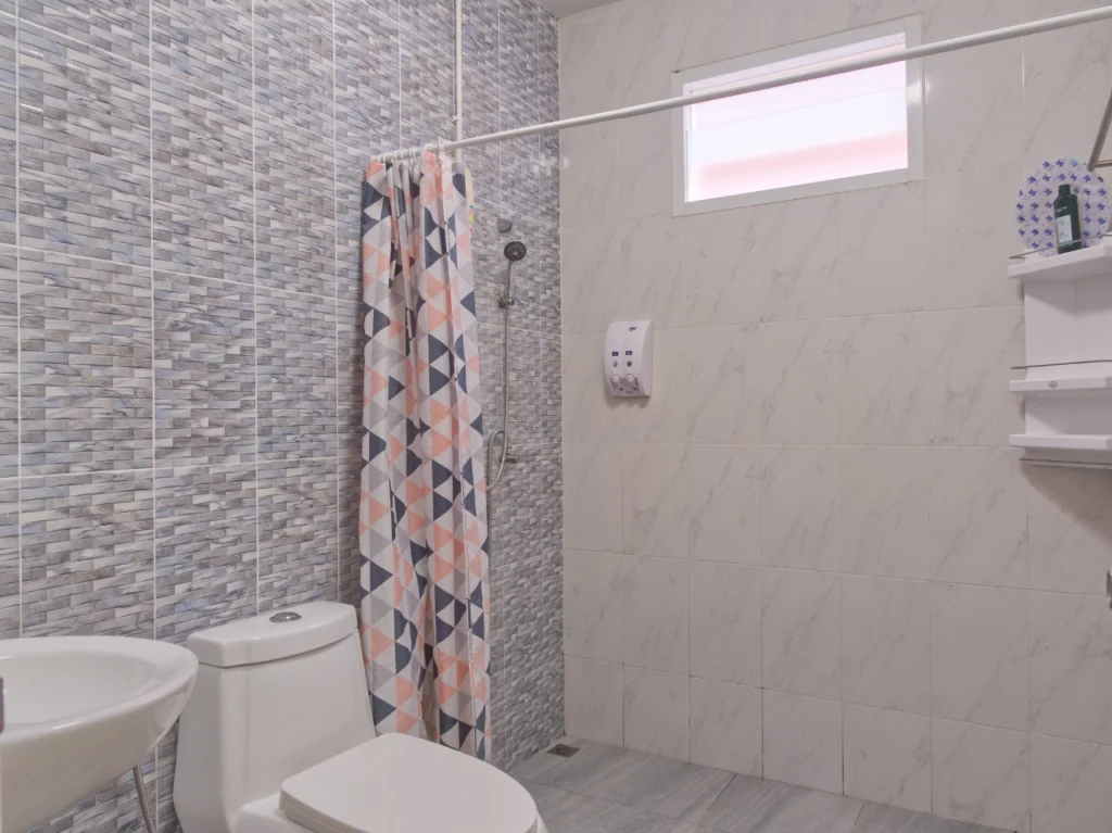 Modern bathroom with shower and sink in Krabi rental home