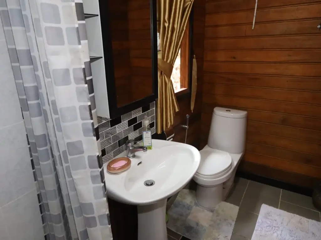 Rustic Thai teak bathroom with modern fixtures in Krabi holiday rental