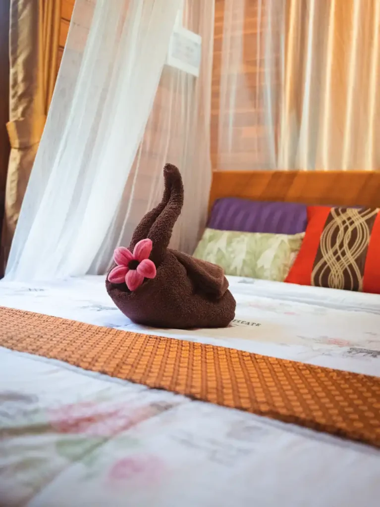 Cozy Krabi rental bedroom with four poster bed and mosquito net covering