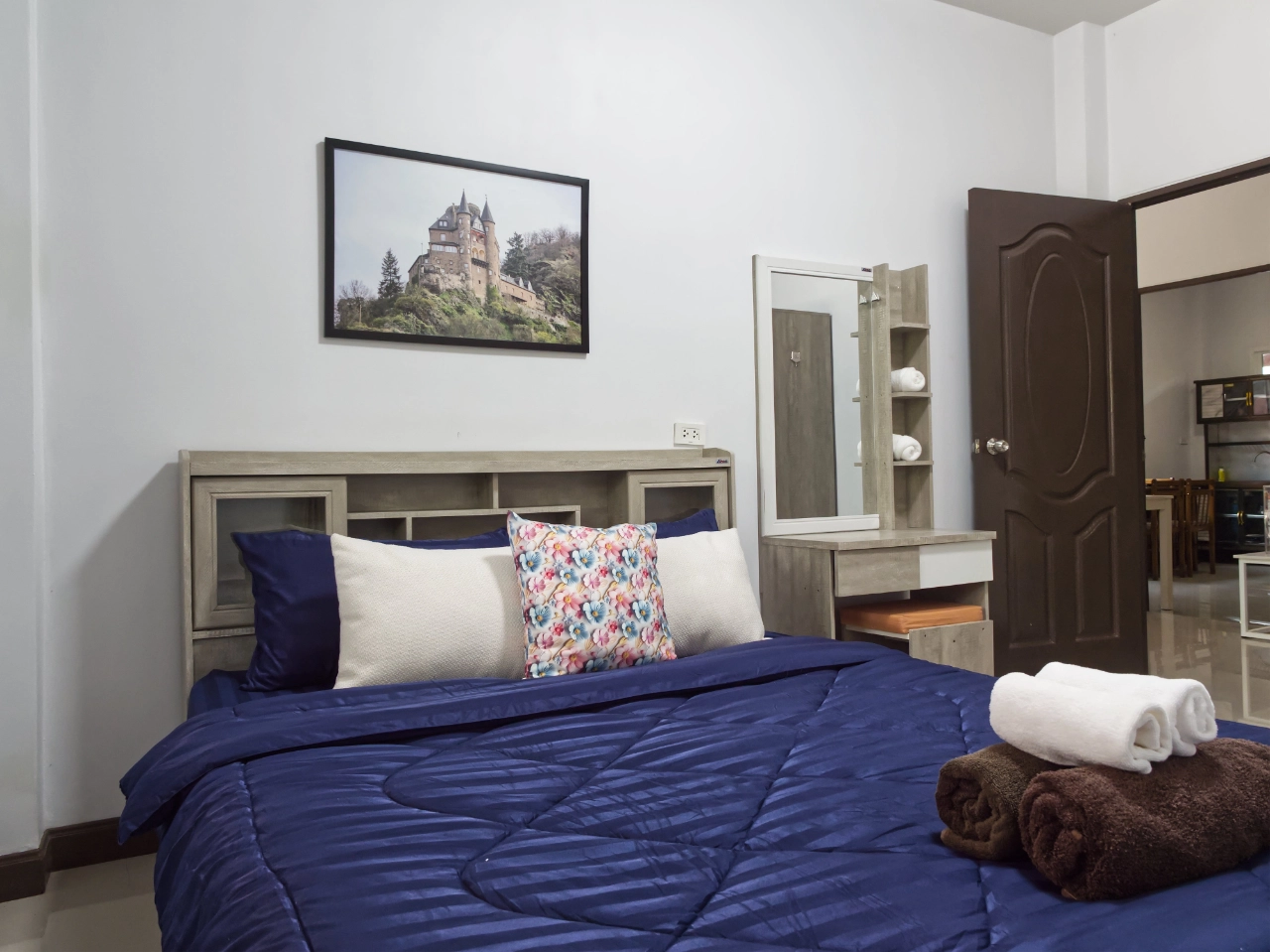 Modern Krabi rental bedroom with comfortable bedding and wardrobe