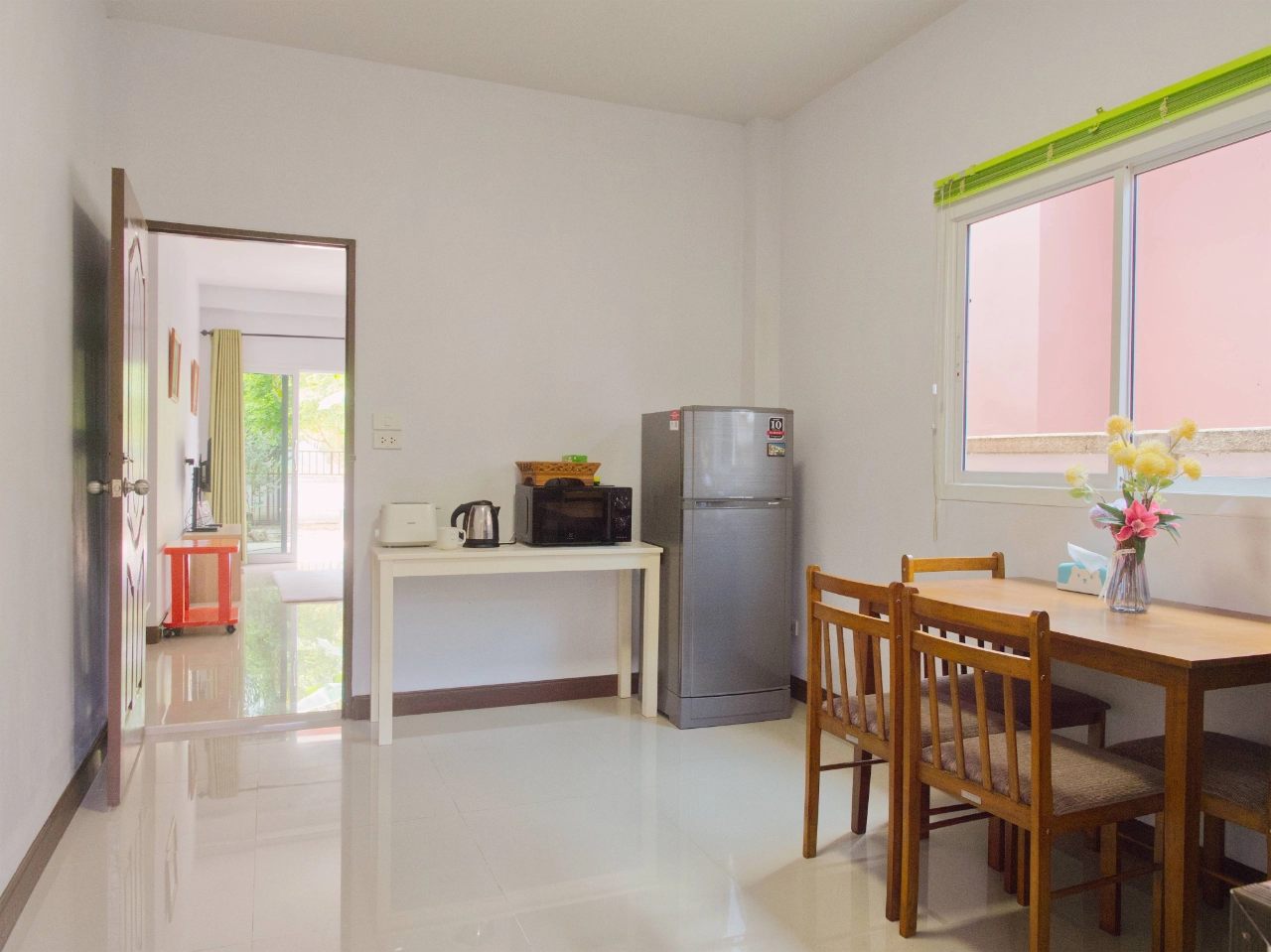 Dining space with kitchen appliances in Krabi holiday house
